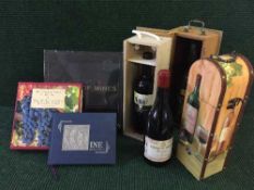 Three bottles of wine, all in presentation wine boxes,