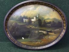 A Victorian painted toleware tray depicting Haddon Hall with mother of pearl inlay