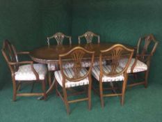 An Bevan & Funnel Regency style inlaid mahogany dining table and six chairs