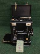 A mid 20th century cased miniature Singer sewing machine