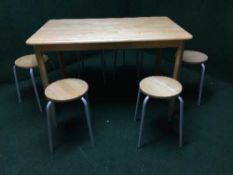 A beech wood kitchen table and six stools