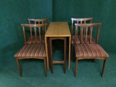 A six piece teak dining room suite