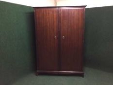 A mahogany stag double door wardrobe