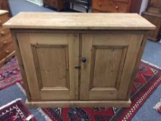 A reclaimed pine double door cabinet