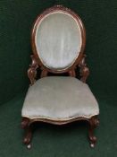 A Victorian mahogany nursing chair