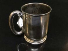 A sterling silver mug,