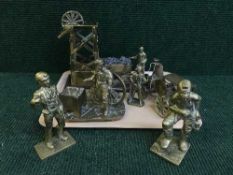 A tray of heavy brass ornaments - traction engine, mining figures,