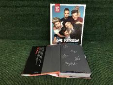 A signed One Direction autobiography, together with the official 2014 annual.
