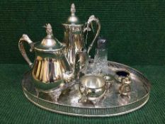 A silver plated gallery tray, three piece plated tea service, plated salts,