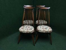 A set of four Ercol high backed dining chairs