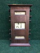 An oak cased scroll calendar