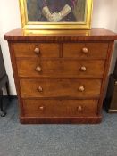 A Victorian mahogany five drawer chest