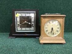 An oak cased Art Deco mantel clock and a pine cased mantel clock
