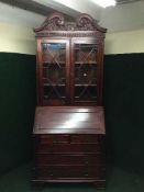 A reproduction Regency style bureau bookcase