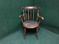 An early twentieth century mahogany ibex armchair together with an oak rush seated stool