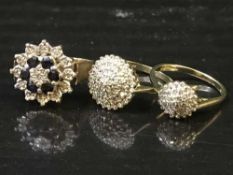 A sapphire and diamond cluster ring, together with two other diamond cluster rings,