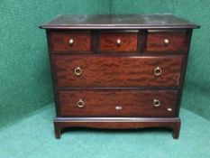 A mahogany stag five drawer chest