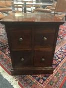A four drawer mahogany cabinet