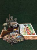 A tray of hand fans, tins, miniature printing set,