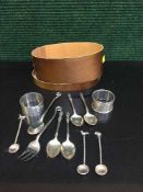 A box of silver napkin rings, Apostle spoons,