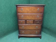A mahogany stag seven drawer chest