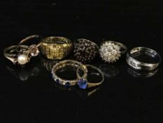 Eight yellow metal dress rings, including one set with diamonds, 27.