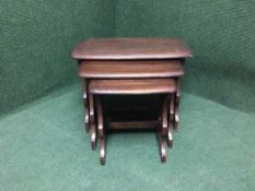 A nest of three Ercol tables