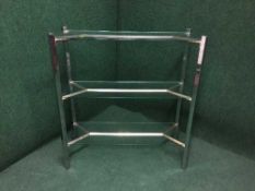A contemporary glass three tier stand
