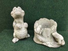 A frog planter together with a figure of a dragon
