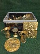 A basket of brass and copper ware