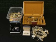 A jewellery box and a collection of costume jewellery, gilt metal chains, silver dress ring,