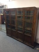 An oak four door glazed bookcase