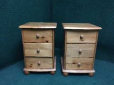 A pair of pine three drawer bedside chests