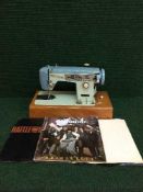 A Brother electric sewing machine a small bundle of lps including Simple Minds,