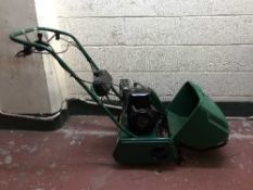 A Qualcast petrol cylinder lawn mower