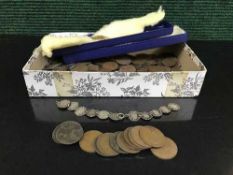 A box of assorted early 20th century British and silver coins,