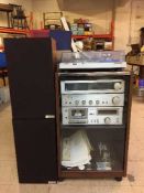 A four piece Technics sperate's system in cabinet and a pair of Mission teak cased speakers