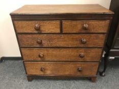 A 19th century oak and inlaid mahogany five drawer chest