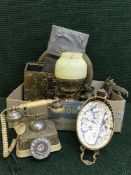 A box of brass charger, vintage style telephone, toasting forks,