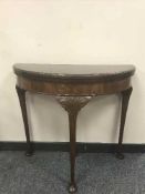 A mahogany d-shaped Georgian style card table