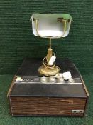 A mid 20th century HMV table top record player and a banker's desk lamp