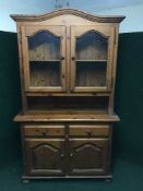 A pine glazed door kitchen dresser