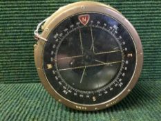 A circular brass ship's compass type P10