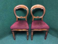 A pair of Victorian mahogany balloon backed chairs