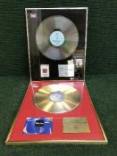 Two 'gold' and 'silver' discs in presentation frames for Thin Ice 2 and Foster and Allan.