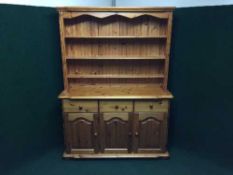 A pine triple door kitchen dresser