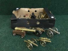 A collection of miniature metal cannons