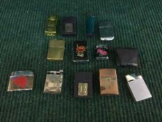 A box of assorted cigarette lighters - Zippo,