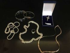 A box of silver bangles, chains,