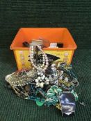 A box of assorted costume jewellery - beaded necklaces,